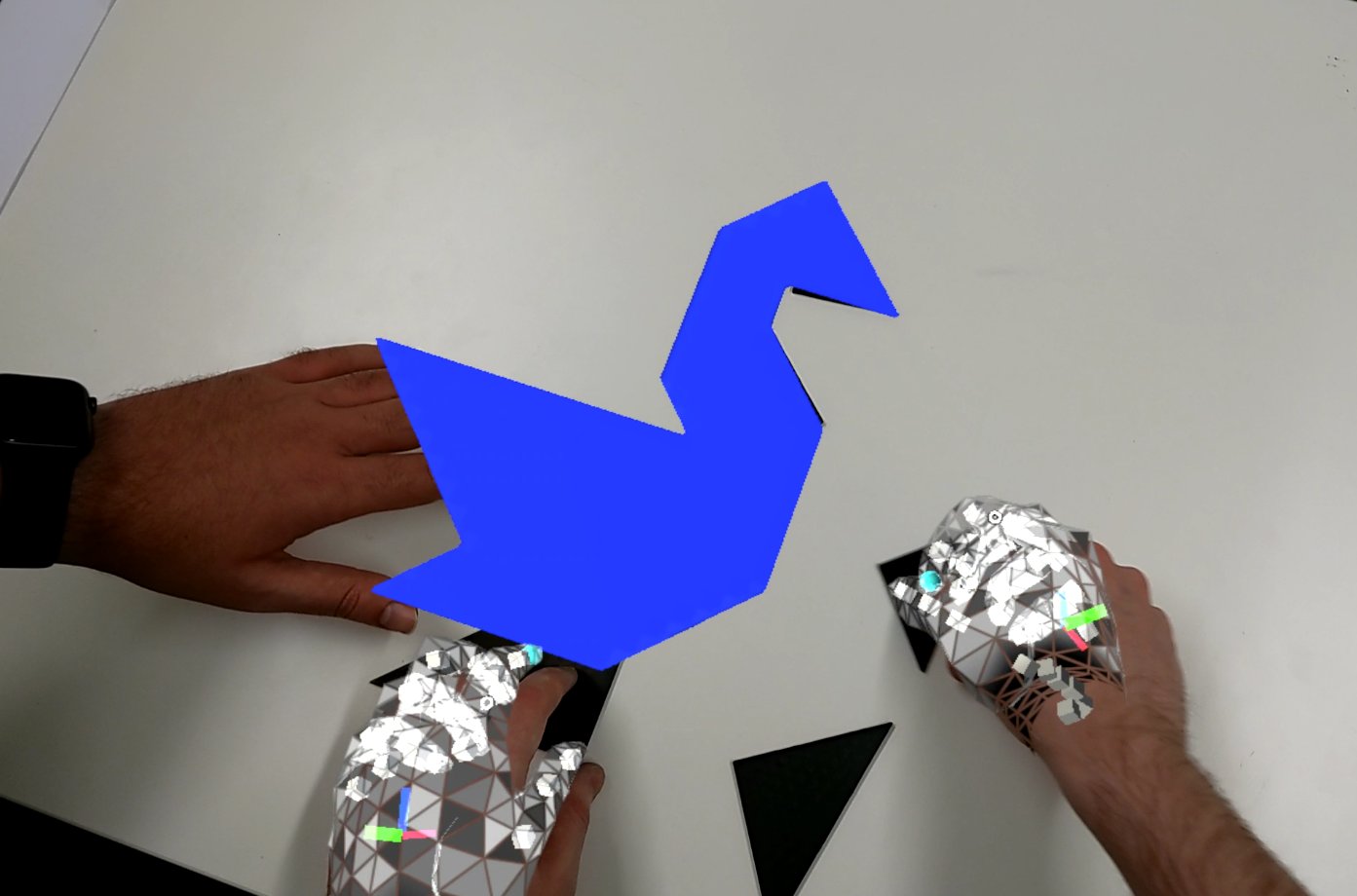 Early solid AR instruction (blue) visible on table during HoloLens recording