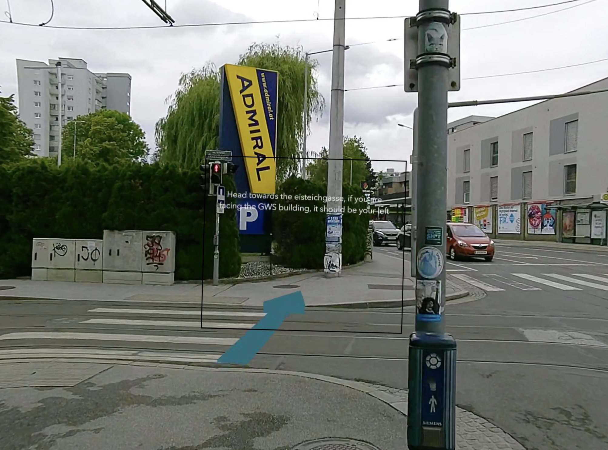 World-anchored arrow at a street crossing in Graz